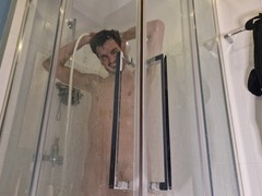 Fit guy with a big dick shows off in the shower