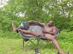 Tormentor Sir Maxximus strokes his massive black cock in the woods