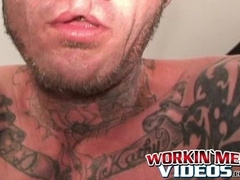 Seductive tattooed hunk jerks off while moaning in hot solo