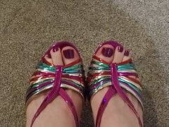 Closeup of male painted toes in rainbow heels