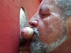 Bear servicing bg uncut cock at his outside glory hole!