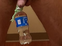 Bottle hanging from balls