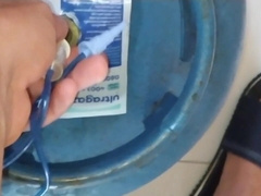 inflating the man's weenie with the gas canister.