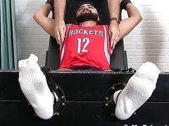 Stud restrained to have his body tickled by two guys