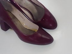 Pissing into co-workers heels