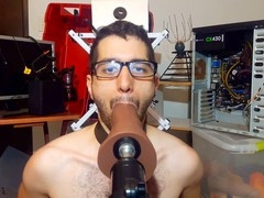 Gay boy locked in cage of Priapus gets toyed with huge dildos and throat training
