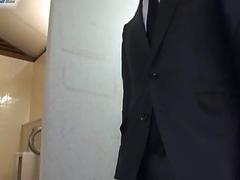 Asian hides in the bathroom to jerk off while wearing a suit