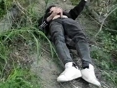 This assfucker lad stuffs his prick thru his fly to wank off outside