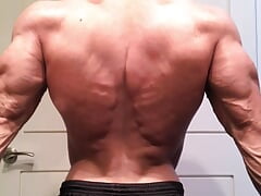 Jacked bodybuilder Benji Bastian flexing his huge, shredded, muscles