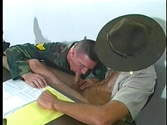 Drill sergeant getting his hard cock sucked by soldier in uniform in the office