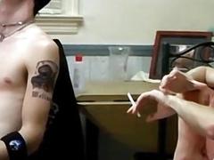 Young men relax while smoking and stroke their hard dicks