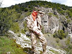 Soldier wanks himself on the mountainside on a warm spring day in the northern rocky mountains.