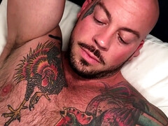 Tattooed bald hunk banging the hell out of a black hunk