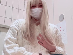 A lady-like fellow strokes in a public toilet