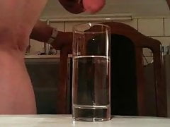 Underwater cumshot in glass of water
