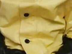 yellow rain gear and rubber boots