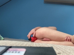 Lil femboy frolicking with his orange faux-cock