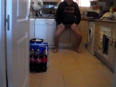 John is pissing all over the kitchen floor