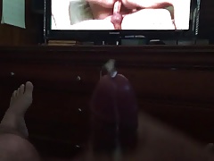 Hairy pierced bear cuming in front of some bareback porn