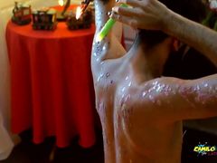 Young Uncut Latino In Colorful Christmas Wax Play With Carols In The Back