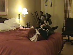 Hogtied, gagged, and blindfolded crossdresser