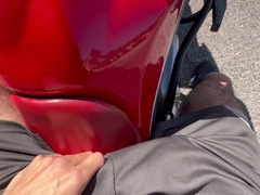 Hefty wood 23cm sensitized in cut-offs sans lingerie taking a motorbike rail on the street