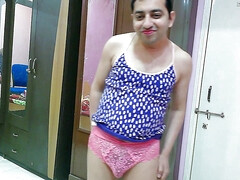 Cute sissy crossdresser femboy Sweet Lollipop in a tank top, pantie and flip-flops with lipstick.