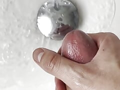Young Latino masturbates in front of his bathroom mirror and cums