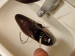 Piss in men's dress shoe