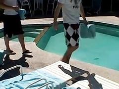 Studs fool around in an outdoor pool and enjoy handjobs