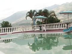 The sun is warm on their skin as they fuck by the pool