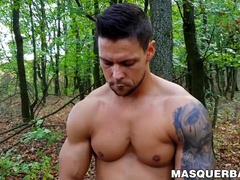 Muscular stud Angelo Godshack wanks off his cock outdoors