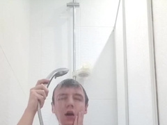Magnificent nude boy takes a douche in front of the camera