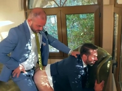 Horny men in suits fuck on the stairs and pose hot