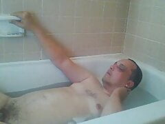 Taking a bath and masturbating alone at home