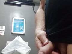 Hot guy plays with cock and gets naked at the mall restroom