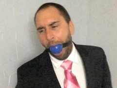 Cuffed Ballgagged and Suit Unwrapped