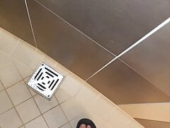Master Ramon pisses next to the urinal in sexy blue satin shorts, lick it on slave