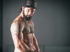 Solo guy with sexy beard jerks that dick until jizz begins to pop all over the couch