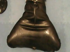 Gagged slave is in the rubber hogsack