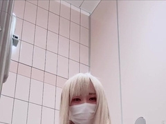 A lady-like fellow strokes in a public toilet