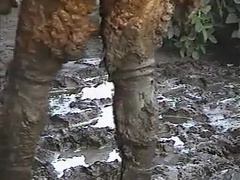 Rubber wetsuit in sticky field clay