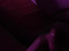 Cumming in purple light