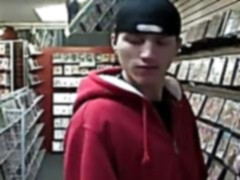 Dude sucking on a big gay dick at the video store gloryhole