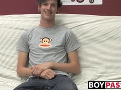 Cute gay guy Danny jerks off his cock on couch solo