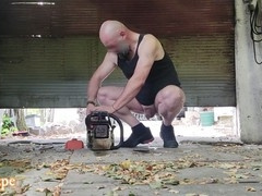 Nasty father urinating in the garage in the nude