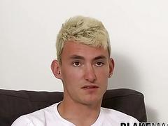 Blond twink talks at an interview before stripping and masturbating
