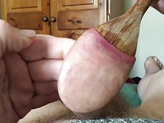Stretch foreskin session - wooden spoon