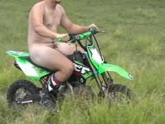 Sporty Aussie hunk riding a dirt bike with his bare booty exposed