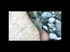 Man peeing on the river